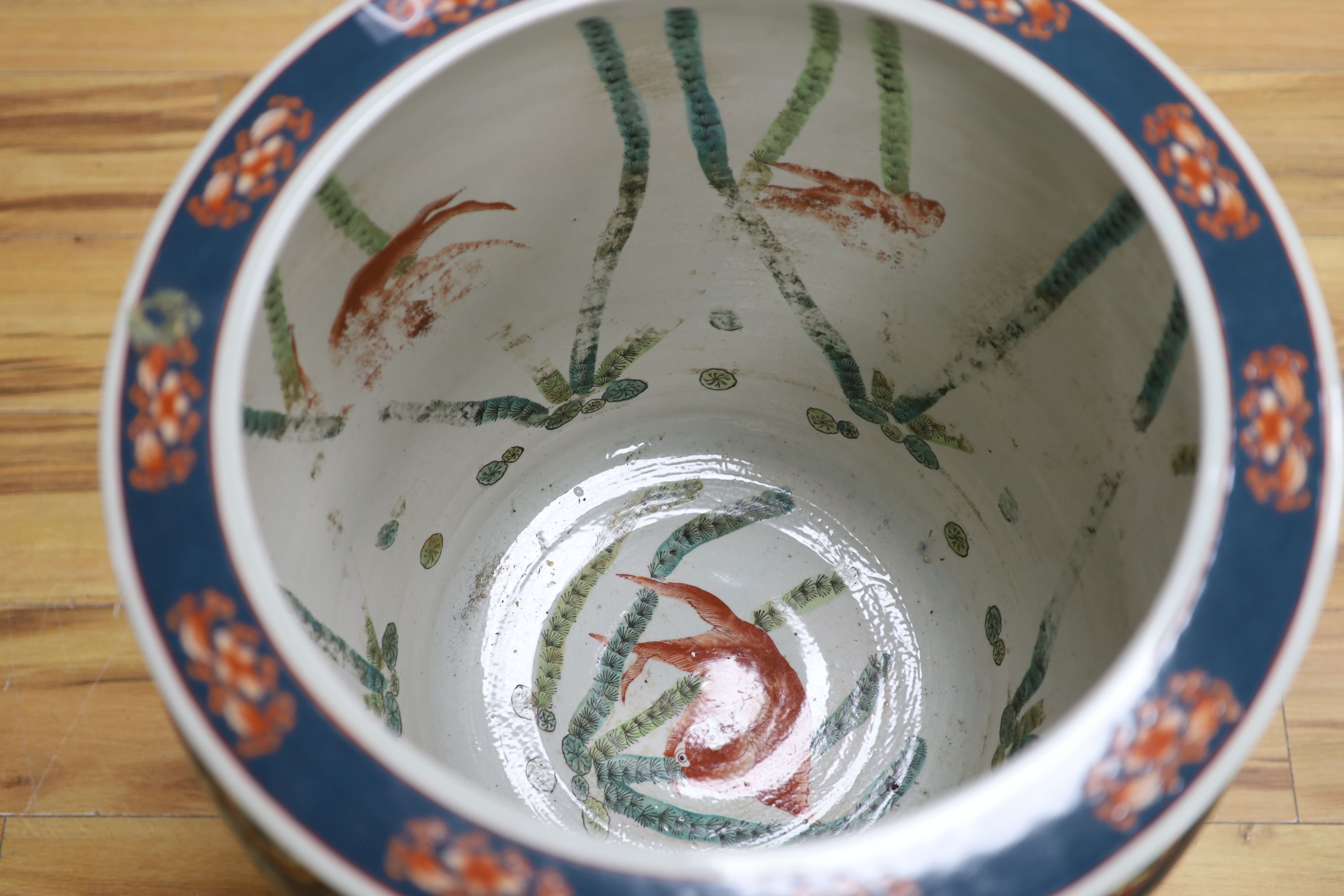 A Chinese porcelain fish bowl on stand, diameter 47cm